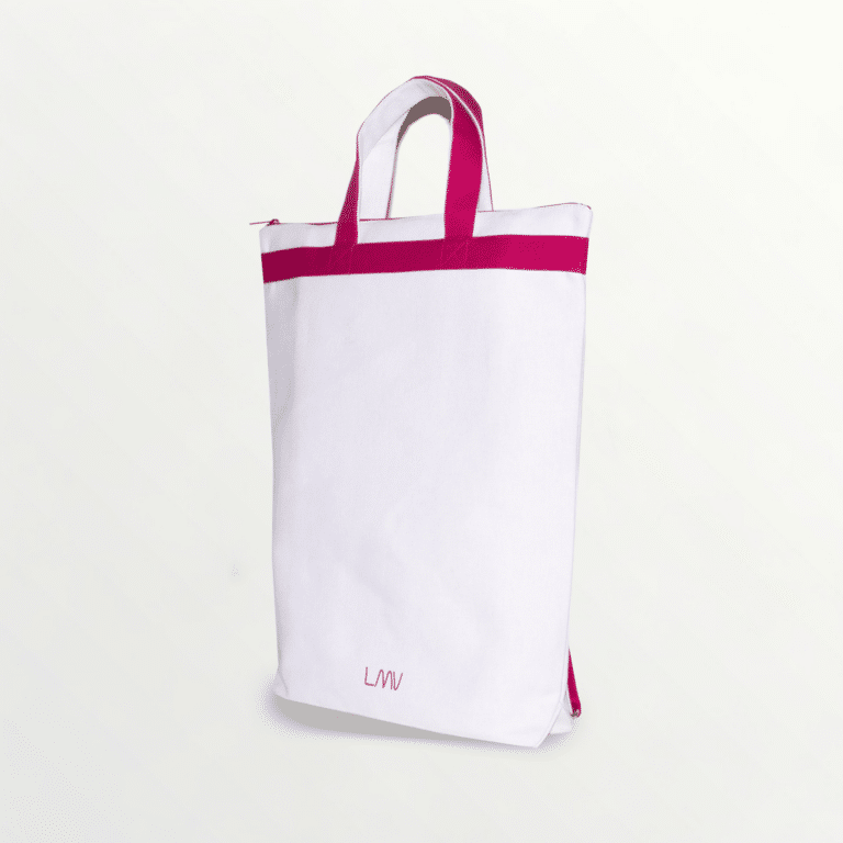 Sac à dos bicolor Neizic avec double porté : épaule et main de couleur rose, de 3 quarts